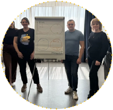 Participants standing beside a presentation board during an EU4Youth training session or policy workshop for public officials and youth leaders in Ukraine.