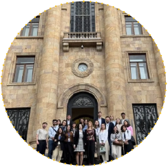 Group of young participants standing in front of a historic building during an EU4Youth study visit to Armenia focused on youth participation and policymaking.
