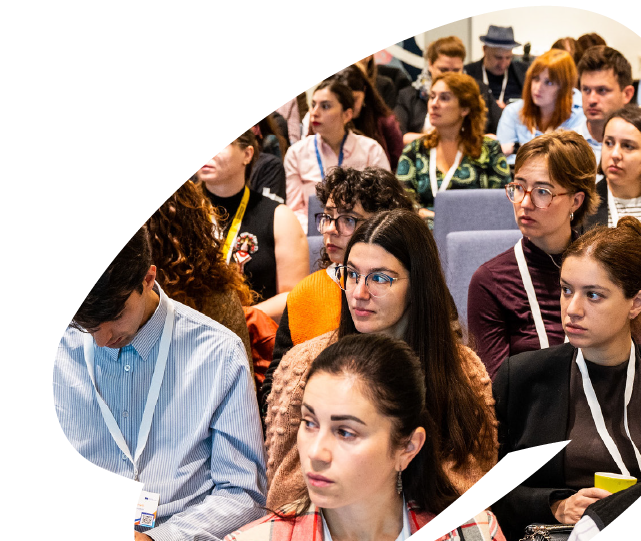 Young participants attending an EU4Youth training or conference session, listening attentively during a presentation or group discussion.