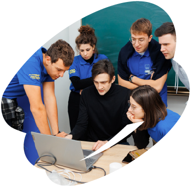Young participants collaborating around a laptop during an EU4Youth digital skills or teamwork training session.