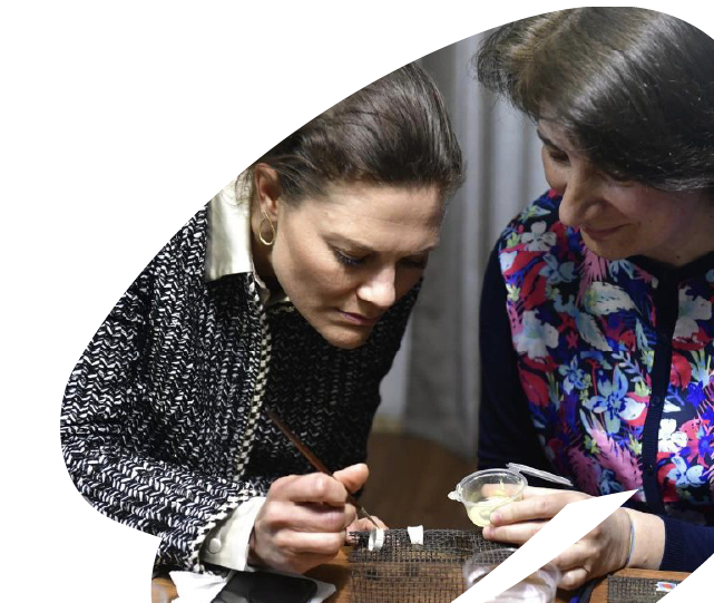 Women participating in a hands-on training or mentoring activity, focusing on practical skills development supported by EU4Youth.