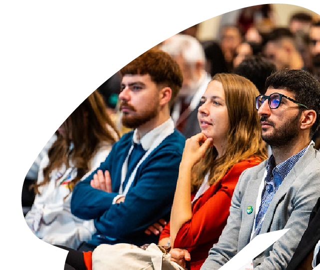 Participants attending an EU4Youth conference or regional event, listening attentively during a presentation or panel discussion.