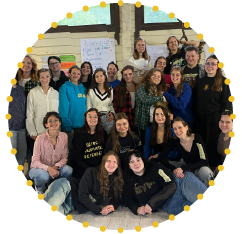 Group photo of young participants during an EU4Youth-supported inclusivity, wellbeing or youth leadership training, gathered indoors for a collaborative learning activity.